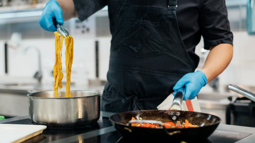 Chef following food safety compliance procedures